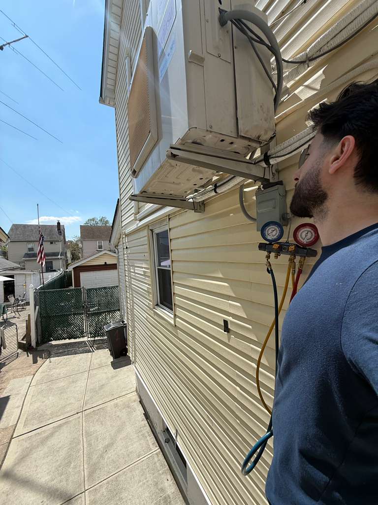 hvac technician after installing a system